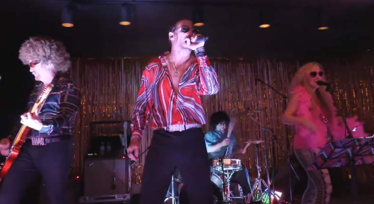 70s disco tribute band passionately performing alongside one another at onstage concert event | Altus Entertainment